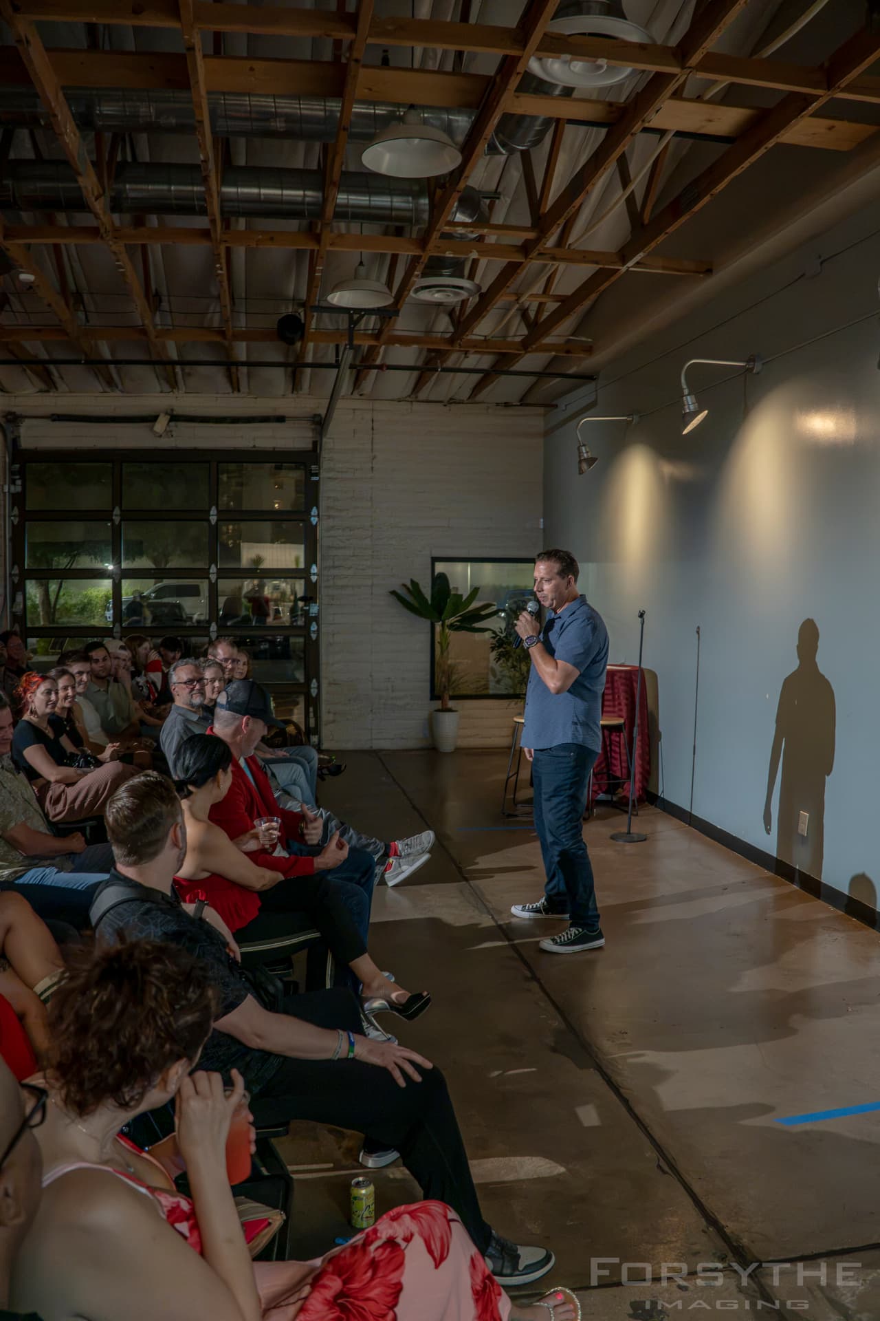 Comedian on stage in the brewery room