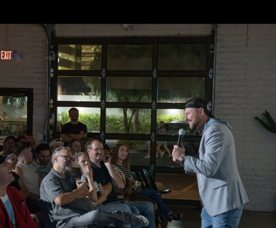 Host under the lights with the front rows laughing